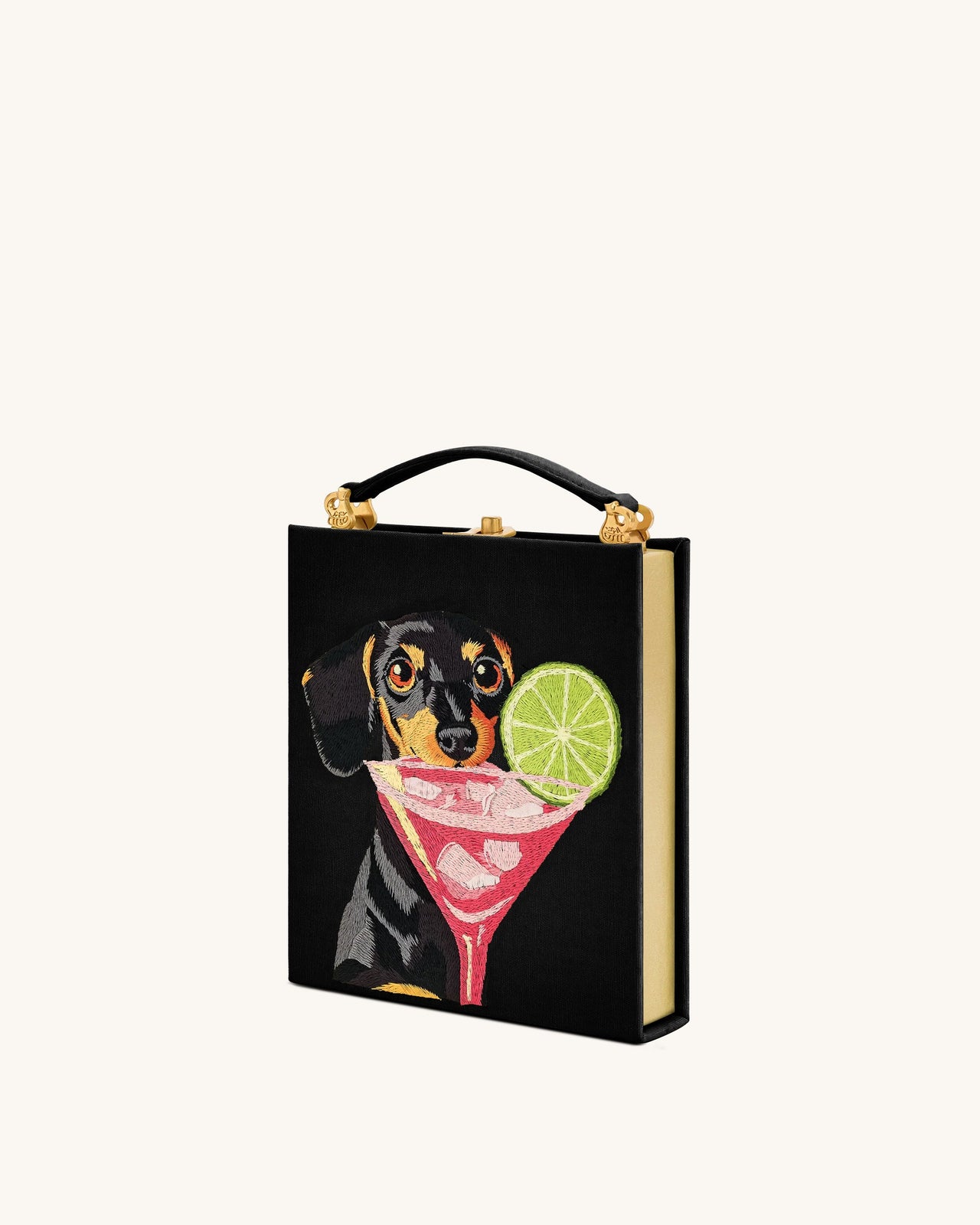 Taya-Clutch in Buchform mit Welpenmuster – Schwarz