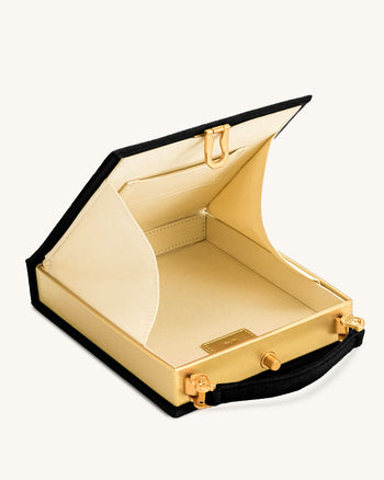Taya-Clutch in Buchform mit Welpenmuster – Schwarz