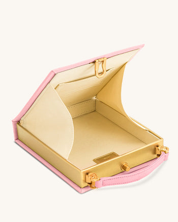 Taya-Clutch in Buchform mit Welpenmuster - Rosa