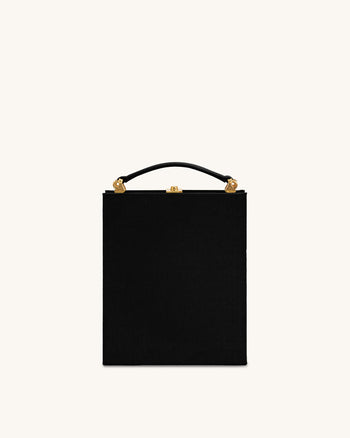 Taya-Clutch in Buchform mit Welpenmuster – Schwarz