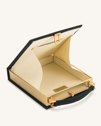 Taya-Feuerwerksmuster Buchform Clutch Bag – Schwarz