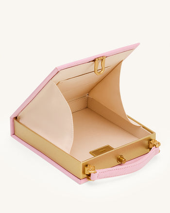 Taya-Clutch in Buchform mit Welpenmuster - Rosa