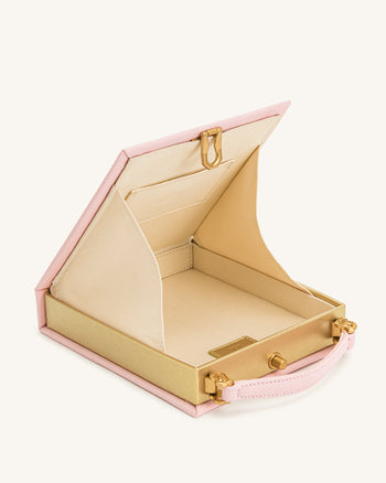 Taya Clutch-Tasche in Buchform mit tropischem Papageienmuster – Rosa