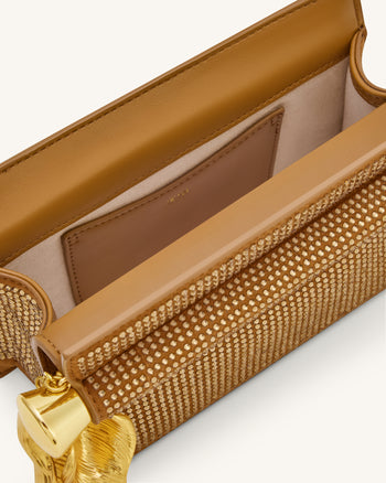 Holly Clutch mit künstlichem Kristall und Metallanhänger - Champagner