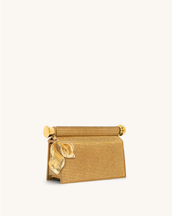 Holly Clutch mit künstlichem Kristall und Metallanhänger - Champagner