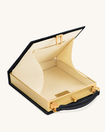Taya Clutch in Buchform mit Orchideenmotiv – Schwarz
