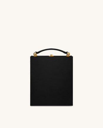 Taya Clutch in Buchform mit Orchideenmotiv – Schwarz