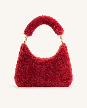 Ruby Schultertasche aus Kunstpelz - Magenta