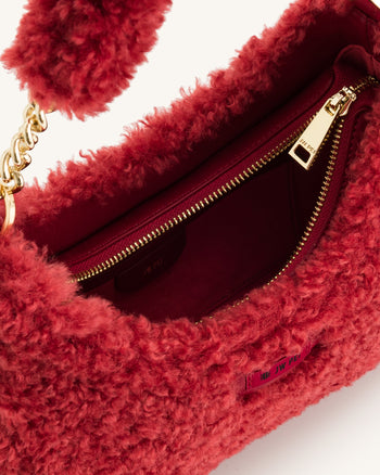 Ruby Schultertasche aus Kunstpelz - Magenta